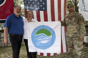 Lt. Col. Sonny B. Avichal, U.S. Army Corps of Engineers Nashville District commander, presents the “Clean Marina” flag to John and Natasha Deane, owners of Wildwood Resort and Marina, during a dedication May 21, 2020 at the resort located at Cordell Hull Lake in Granville, Tennessee. The event recognized the marina’s voluntary efforts to reduce water pollution and erosion in the Cumberland River watershed, and for promoting environmentally responsible marina and boating practices. (USACE photo by Lee Roberts)